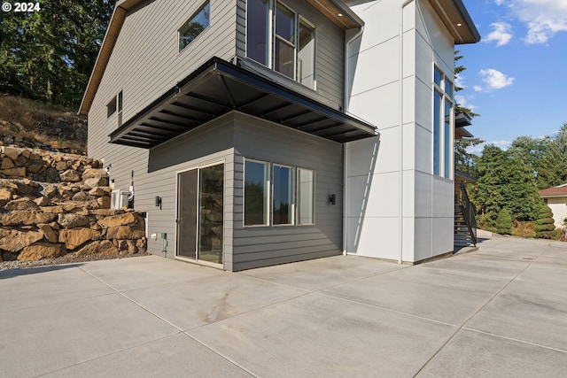 view of property exterior featuring a patio area