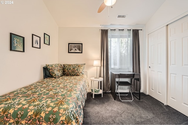 carpeted bedroom featuring ceiling fan, lofted ceiling, and a closet