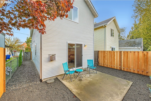 rear view of property featuring a patio area