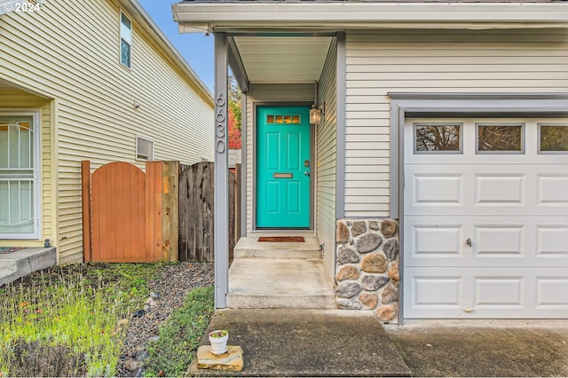 doorway to property featuring a garage