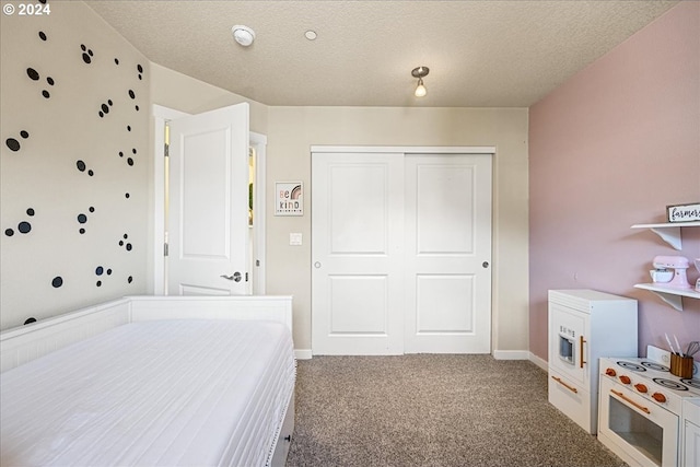 carpeted bedroom featuring a closet and a textured ceiling