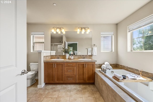 full bathroom with tile patterned flooring, vanity, independent shower and bath, and toilet