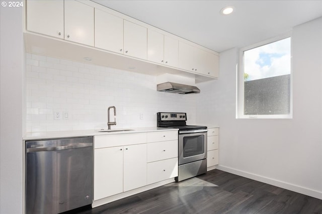 kitchen featuring white cabinets, appliances with stainless steel finishes, sink, and dark hardwood / wood-style floors