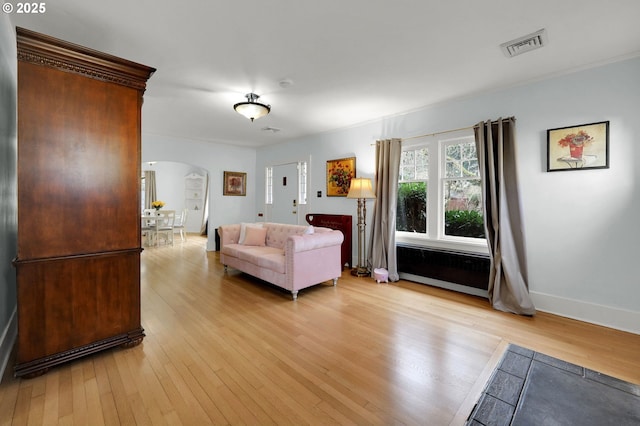 unfurnished living room featuring light wood-type flooring