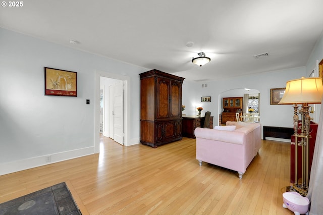 living room with light hardwood / wood-style flooring