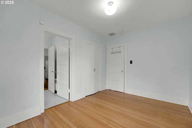 empty room featuring wood-type flooring