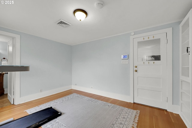 entryway with wood-type flooring