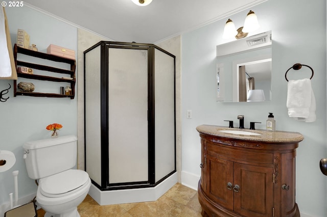 bathroom with vanity, toilet, and an enclosed shower