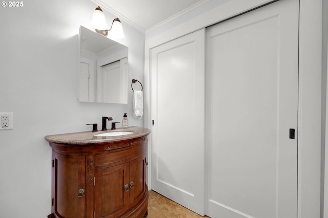 bathroom featuring vanity, tile patterned floors, and ornamental molding