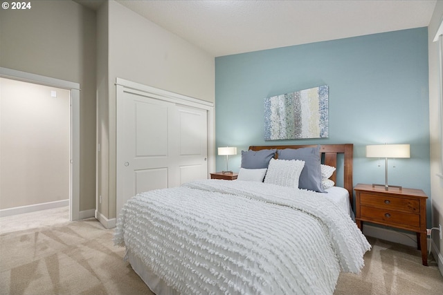 bedroom featuring a closet and carpet flooring