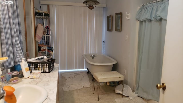 bathroom featuring a bath and sink