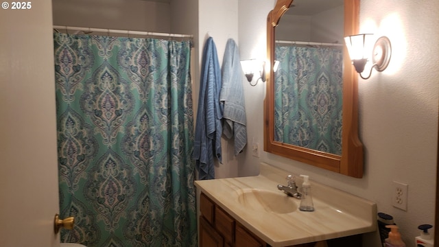 bathroom with a shower with curtain and vanity