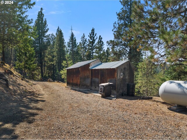 view of home's exterior featuring an outdoor structure