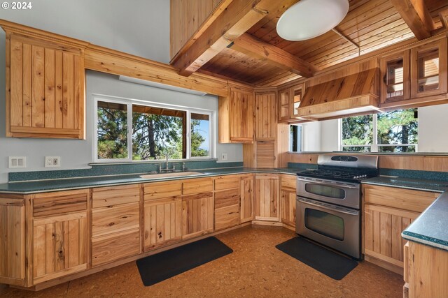 kitchen featuring stainless steel stove, wood ceiling, sink, premium range hood, and beam ceiling