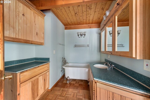 bathroom with a tub, wood ceiling, parquet flooring, and vanity