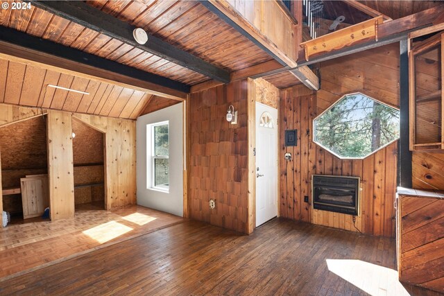 interior space featuring wood ceiling, vaulted ceiling with beams, wooden walls, and dark hardwood / wood-style flooring