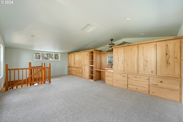 bonus room featuring vaulted ceiling, a healthy amount of sunlight, and carpet