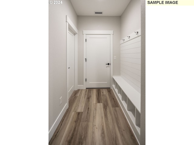 mudroom with hardwood / wood-style flooring