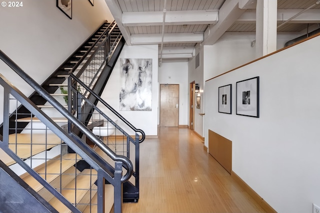 hall featuring wood ceiling, beamed ceiling, and light hardwood / wood-style flooring