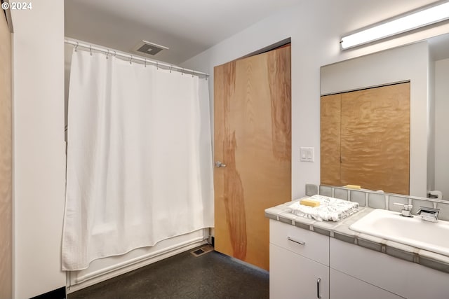 bathroom with shower / bathtub combination with curtain and vanity