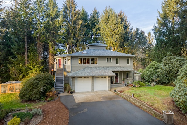 front of property featuring a garage and a front yard