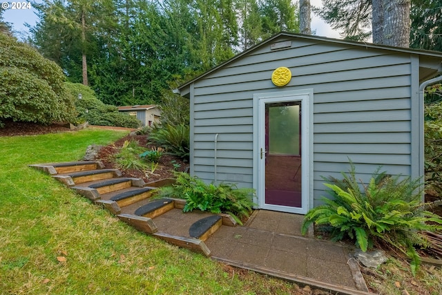 view of outbuilding with a lawn