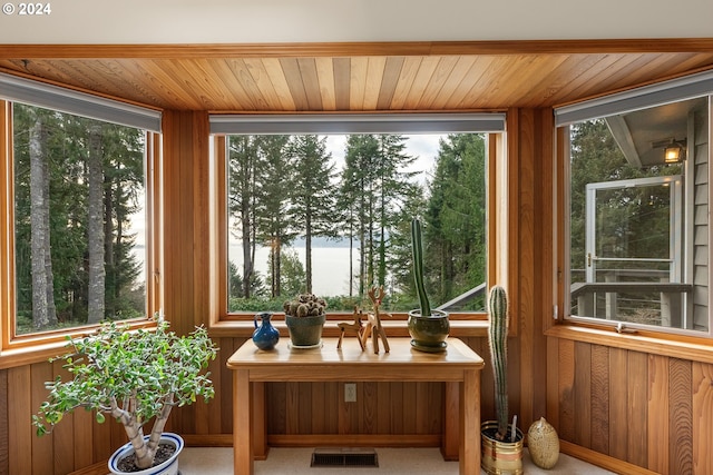 sunroom / solarium featuring wooden ceiling