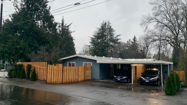 ranch-style home featuring a carport