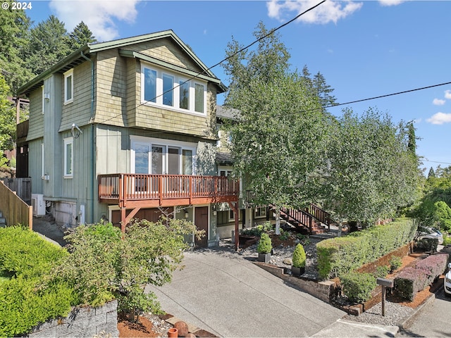 exterior space featuring a wooden deck and central AC