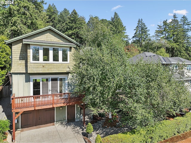 view of front of property featuring a wooden deck and a garage