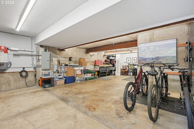 garage featuring a workshop area and electric panel