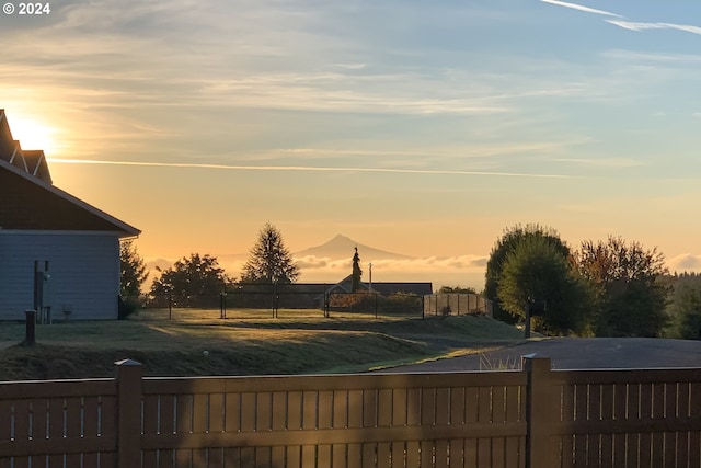 view of pool at dusk