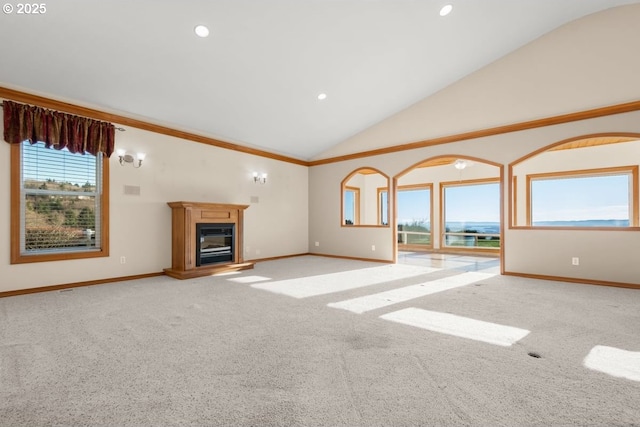 unfurnished living room featuring carpet floors and high vaulted ceiling