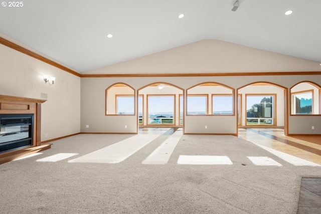 unfurnished living room featuring light carpet and vaulted ceiling