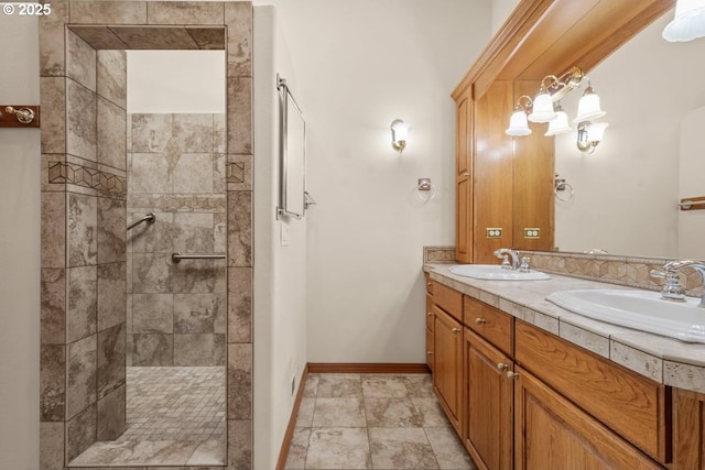 bathroom featuring vanity and tiled shower