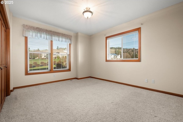 unfurnished room with carpet floors