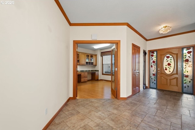 foyer entrance with built in desk and crown molding