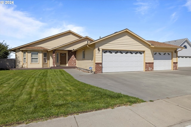 ranch-style house with a garage and a front yard