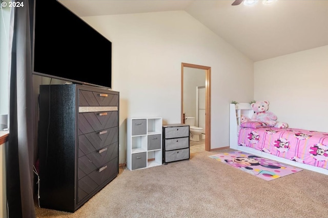 carpeted bedroom featuring ensuite bath, ceiling fan, and lofted ceiling