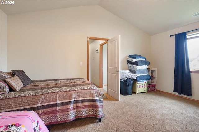 carpeted bedroom featuring lofted ceiling