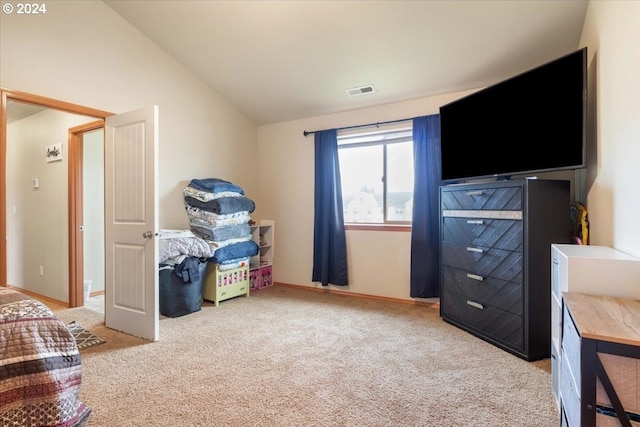 bedroom featuring carpet flooring and vaulted ceiling