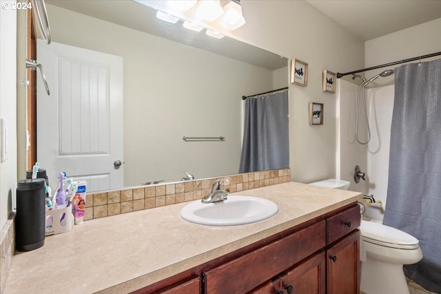 full bathroom with shower / bathtub combination with curtain, vanity, and toilet