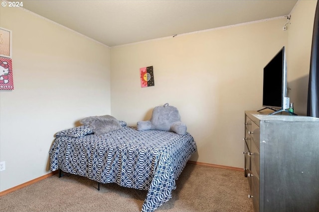 bedroom featuring light carpet