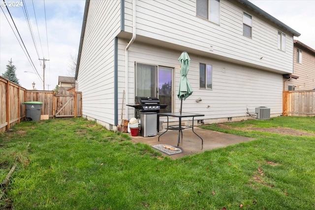 back of house featuring a patio, central air condition unit, and a lawn