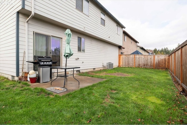 view of yard with cooling unit and a patio