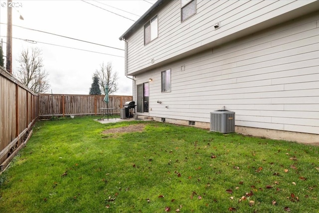 view of yard featuring central air condition unit