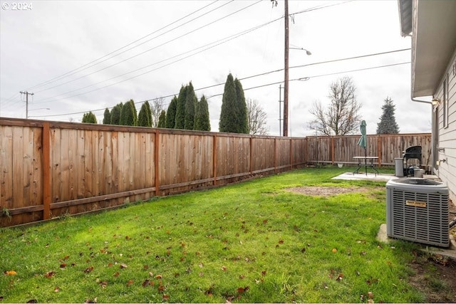 view of yard featuring central air condition unit