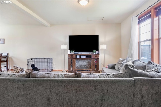 living room with beam ceiling