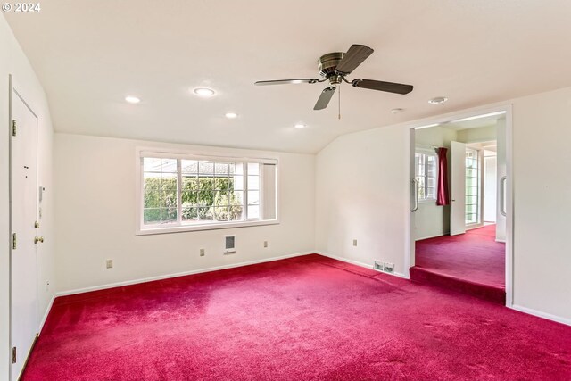 carpeted empty room featuring ceiling fan and lofted ceiling