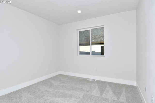 spare room featuring carpet floors